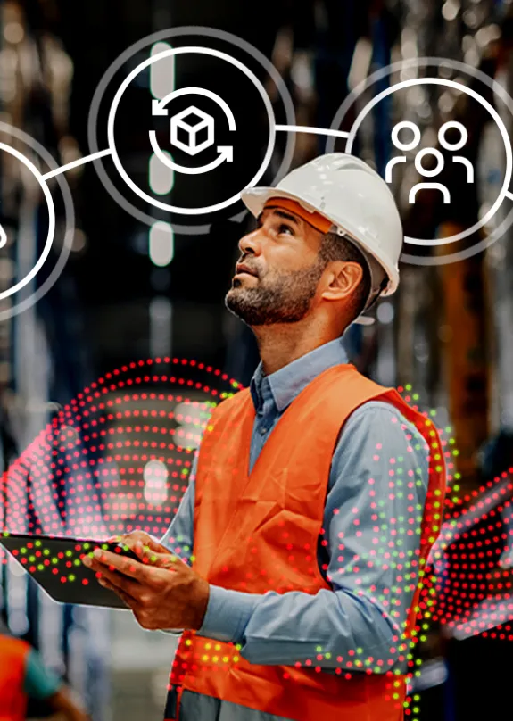 Man standing in warehouse in protective safety clothing surrounded by eco friendly icons