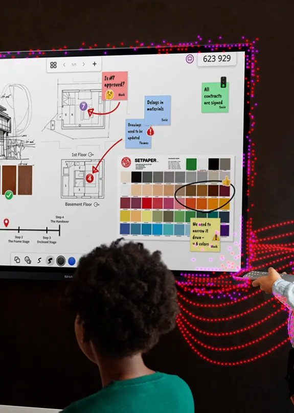 Group of people having a meeting with a Sharp Display