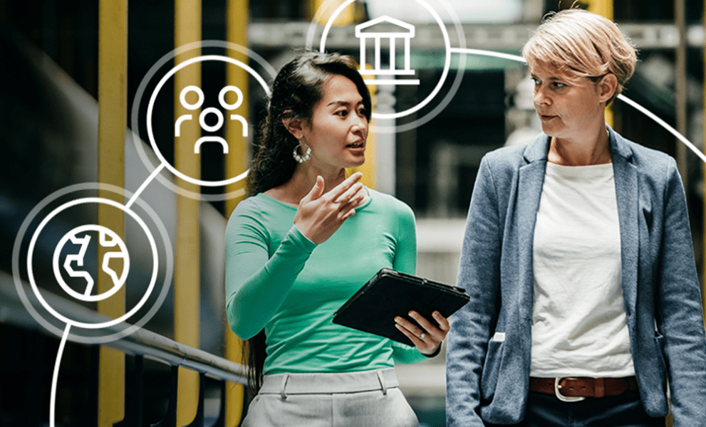 Two women walking through a warehouse working surrounded by icons representing ESG compliance, standards and policies