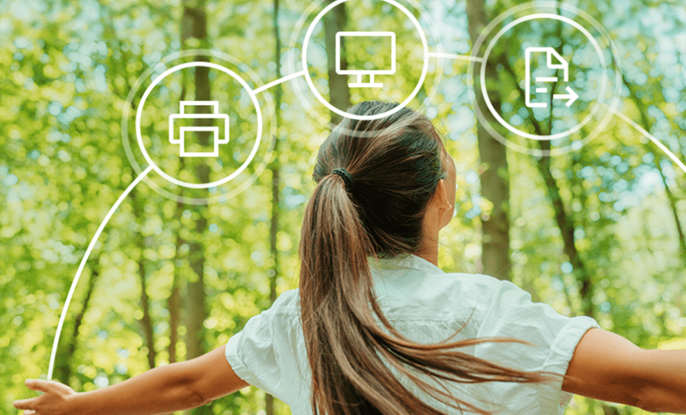 A woman stood infront of greenery with Sharp green product icons